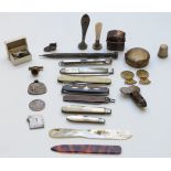 A collection of hallmarked silver and other fruit and pen knives, intaglio seals, pens, pencils,