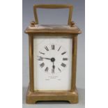 Late 19th/early 20thC French brass carriage clock by Allen and Daws, Norwich, the white enamel Roman