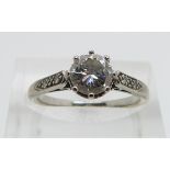 Art Deco 18ct white gold ring set with a diamond of approximately 0.8ct with further diamonds to the