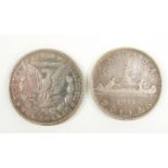 1889 Morgan dollar together with a George V 1935 Canadian dollar