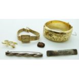 A rolled gold bangle, two silver brooches, Rotary watch and a brooch