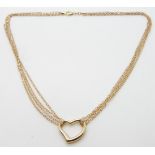 A 9ct gold triple strand necklace with a heart pendant, 3.1g