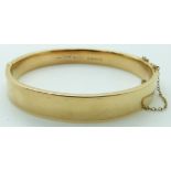 A hallmarked 15ct gold bangle, Chester 1909, 14.2g