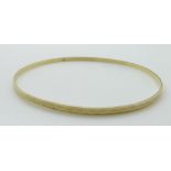 A 9ct gold bangle with cut out decoration, 4.4g