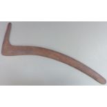 A 19thC Australian Aboriginal hunting boomerang or throwing stick with carved parallel lines and