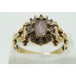 A 9ct gold ring set with quartz and cubic zirconia, size R