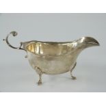 George V hallmarked silver sauce boat raised on three feet, Birmingham 1912 maker George Nathan &