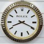 Rolex dealers shop display advertising wall clock with gold hands and baton markers, white dial