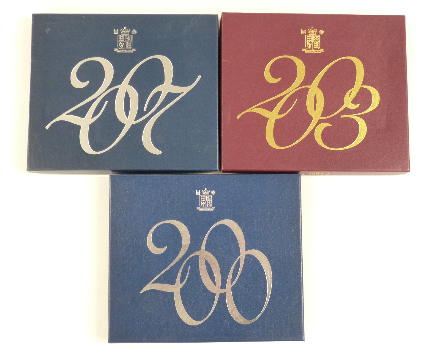 Three Royal Mint proof coin sets comprising 2007-12 coins including three £2 and two 50p, 2003