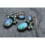 A pair of Victorian earrings set with two opal cabochons and enamel, 2.5cm drop