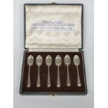 Cased set of six hallmarked silver spoons illustrating six different British hallmarks, maker