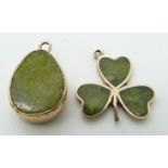 A 9ct gold charm in the form of a clover / shamrock set with serpentine and a similar yellow metal