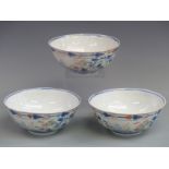 A set of three Chinese Tongzhi mark and period pedestal bowls with dragon decoration, height 7cm,