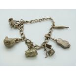A silver charm bracelet with six charms