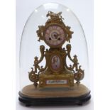 French ormolu style mantel clock with Sevres panels, the movement striking on a bell, raised on