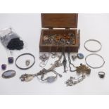 A collection of silver jewellery including rings, brooches, moonstone necklace, silver pen, RAF
