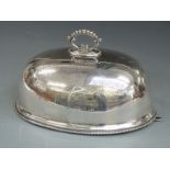 A large silver plated meat dome, length 36cm