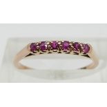 A 14ct gold ring set with rubies, size L/M