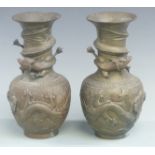 Pair of Chinese bronze or similar dragon vases with character marks to base, height 25.5cm