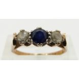 A 9ct gold ring set with a sapphire and paste, size L