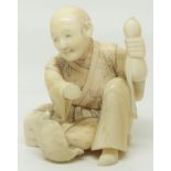 A 19thC Chinese carved ivory netsuke of a seated man with a tortoise, height 3.2cm