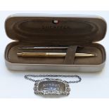 Hallmarked silver sherry label and a Sheaffer ballpoint pen