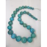 A large beaded turquoise necklace, largest bead 3cm, smallest bead 1cm