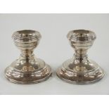 A pair of hallmarked silver squat candlesticks, Birmingham 1909 maker Henry Clifford Davis, height