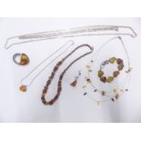 A beaded amber necklace, silver bracelet set with pressed amber, silver and amber necklace,