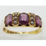 Edwardian 15ct gold ring set with garnets and seed pearls, Birmingham 1902, size Q