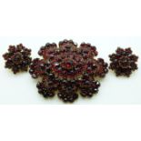 Victorian brooch set with Bohemian cut garnets in a tiered setting, with matching earrings