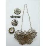 A filigree brooch in the form of a butterfly, silver brooch set with seed pearls, a reverse