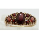 A 9ct gold ring set with garnets, size Q