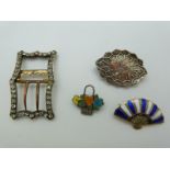 A Victorian silver brooch with applied gold detail, a silver Siam fan brooch set with enamel, a