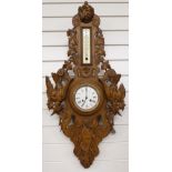 Late nineteenth / early twentieth century black forest carved wall clock / thermometer compendium.