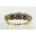 An 18ct gold ring set with five graduated round cut diamonds, the centre diamond approximately 0.