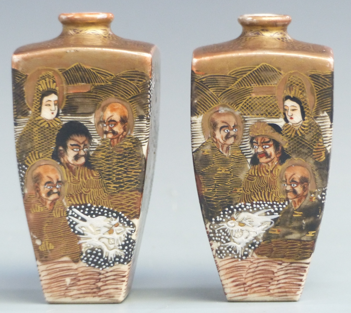 A pair of Japanese Satsuma vases with immortals and dragon decoration, signed, height12cm