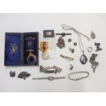 A collection of silver jewellery including identity bracelet, Siam pendant, brooches and earrings,