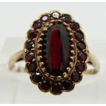 A 9ct gold ring set with garnets, size J