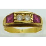 A yellow metal ring set with white sapphires and synthetic rubies, size M