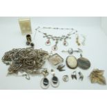 Eighteen silver necklaces, three silver bracelets, silver pendant, brooch set with shell, lucite