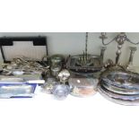 A quantity of silver plate including candlesticks, serving dishes, loose cutlery etc
