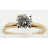 A 14k gold ring set with round brilliant cut diamond of approximately 0.8ct, size I (the following