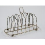 Edward VII hallmarked silver seven bar toast rack raised on four ball feet, London 1905 maker Samuel