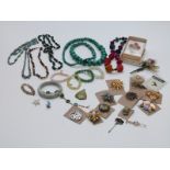 A collection of costume jewellery including agate bangle, agate bracelet, vintage brooches including