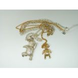 A 9ct gold teddy pendant and chain (3.1g) and silver teddy bear pendant and chain