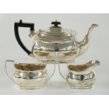 George V hallmarked silver three piece tea set comprising teapot, Chester 1935 and jug and sugar