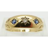 An 18ct gold ring set with a diamond and two sapphires, Birmingham 1896, size R