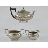 Edward VII Scottish hallmarked silver three piece tea set with reeded lower section, Glasgow 1908