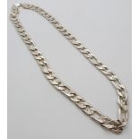 A white metal necklace made up of curb links